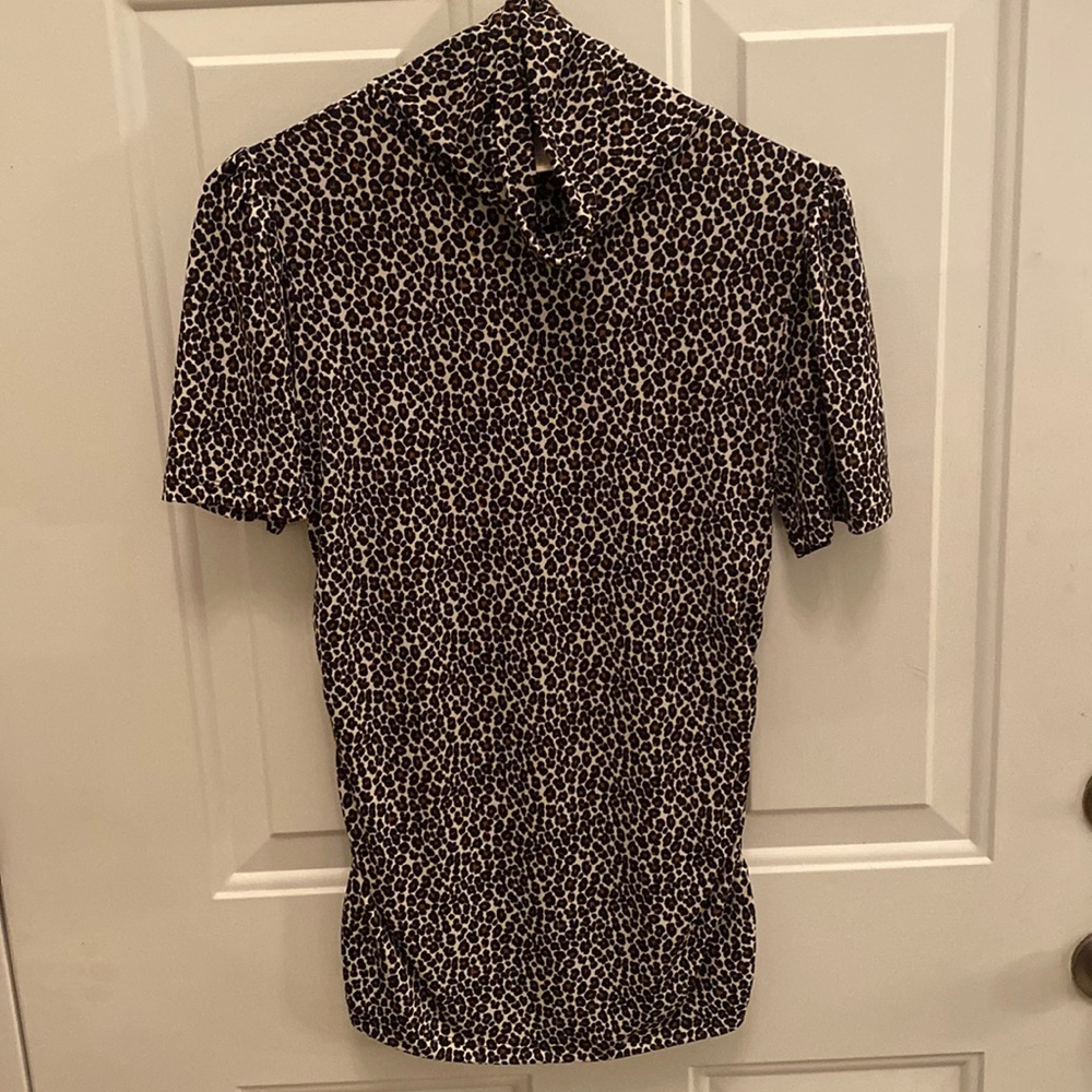 Micheal Kora turtleneck blouse. Size small. Cute for the summer.